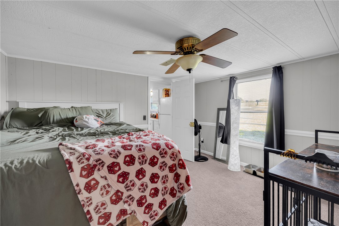 150 Newberry Road Walhalla, SC 29691 - Photo 17 of 47 Relax in this well-lit bedroom featuring soft carpeting and an efficient ceiling fan for comfort.