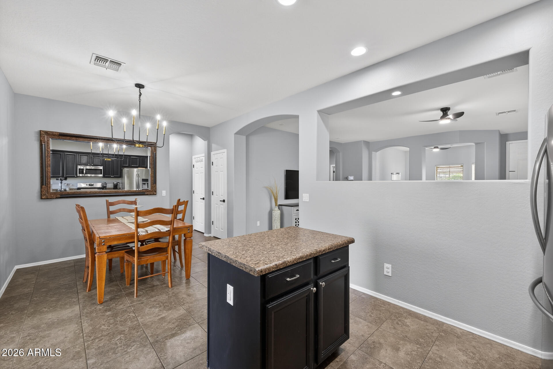 724 West Trellis Road Queen Creek, AZ 85140 - Photo 10 of 46 a view of a dining room with furniture