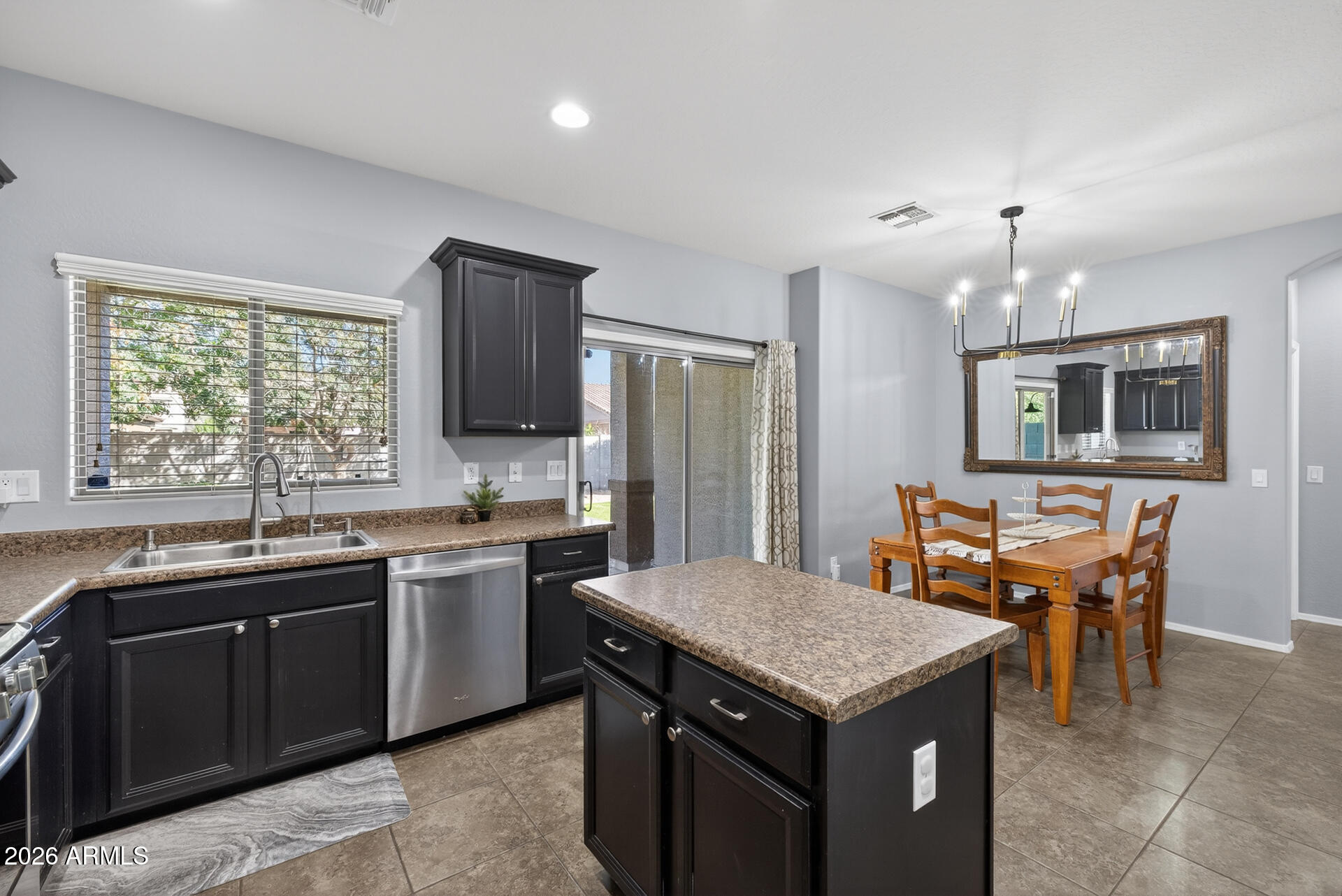 724 West Trellis Road Queen Creek, AZ 85140 - Photo 11 of 46 a kitchen with a stove sink and refrigerator