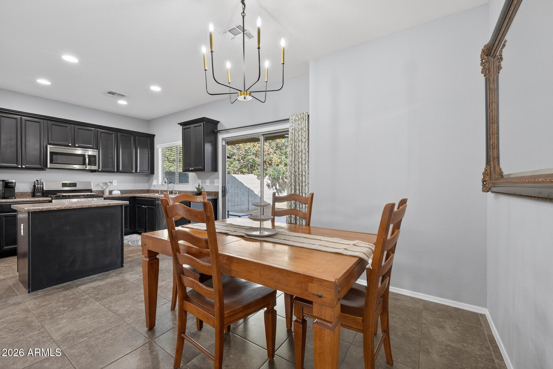 724 West Trellis Road Queen Creek, AZ 85140 - Photo 13 of 46 a view of a dining room with furniture window and outside view