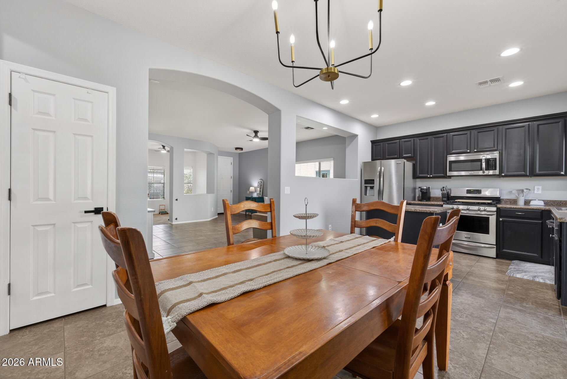 724 West Trellis Road Queen Creek, AZ 85140 - Photo 16 of 46 a view of a dining room with furniture