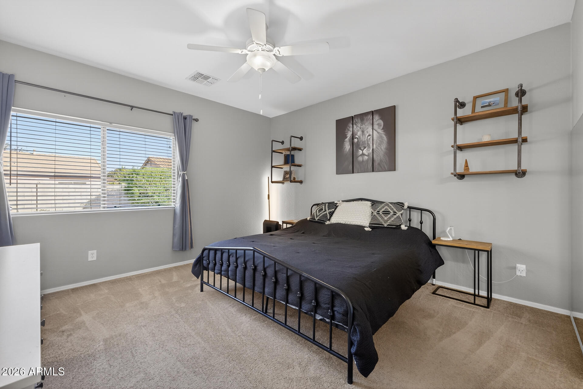 724 West Trellis Road Queen Creek, AZ 85140 - Photo 17 of 46 a bedroom with a bed and a window