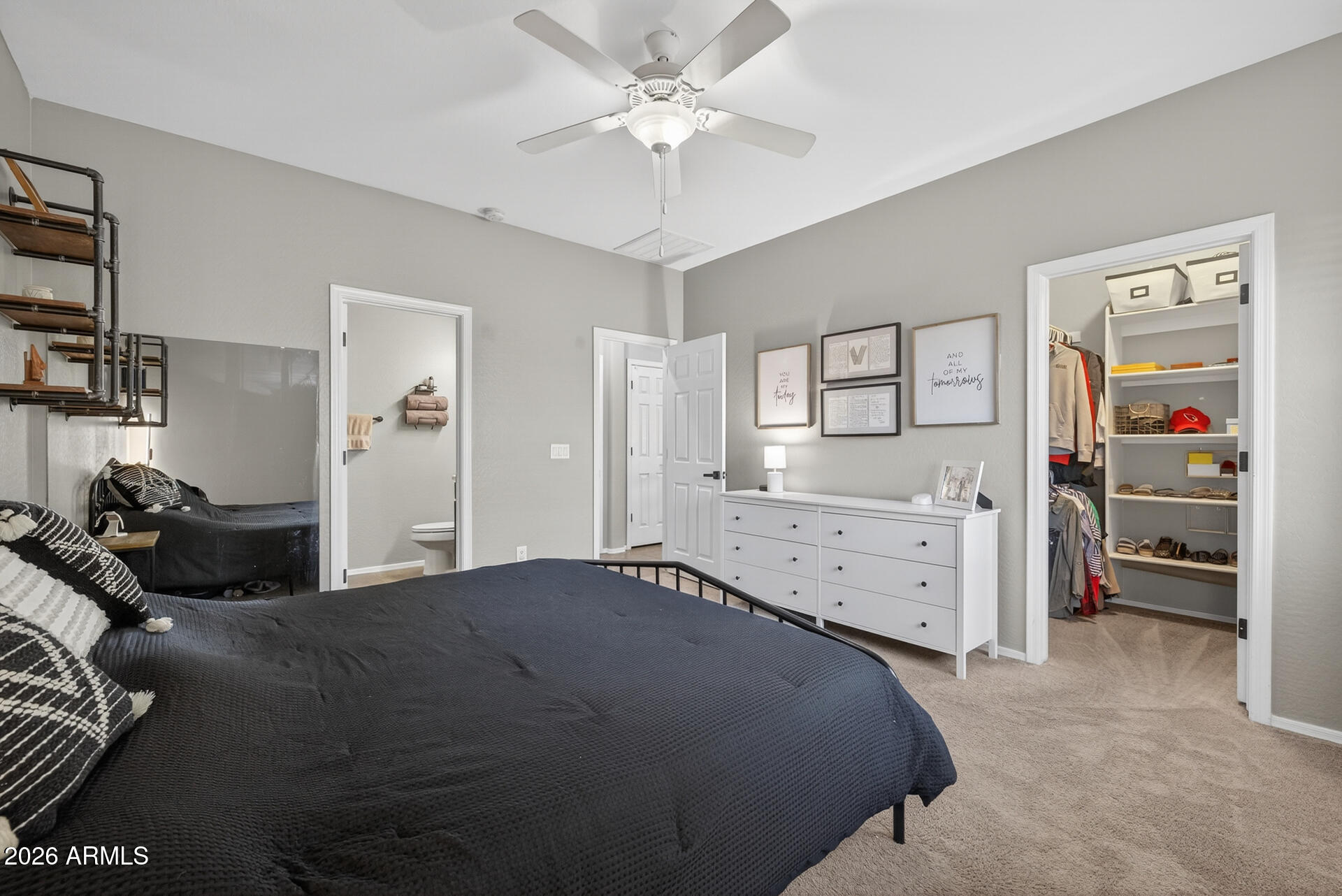 724 West Trellis Road Queen Creek, AZ 85140 - Photo 18 of 46 a bedroom with a bed and a chandelier