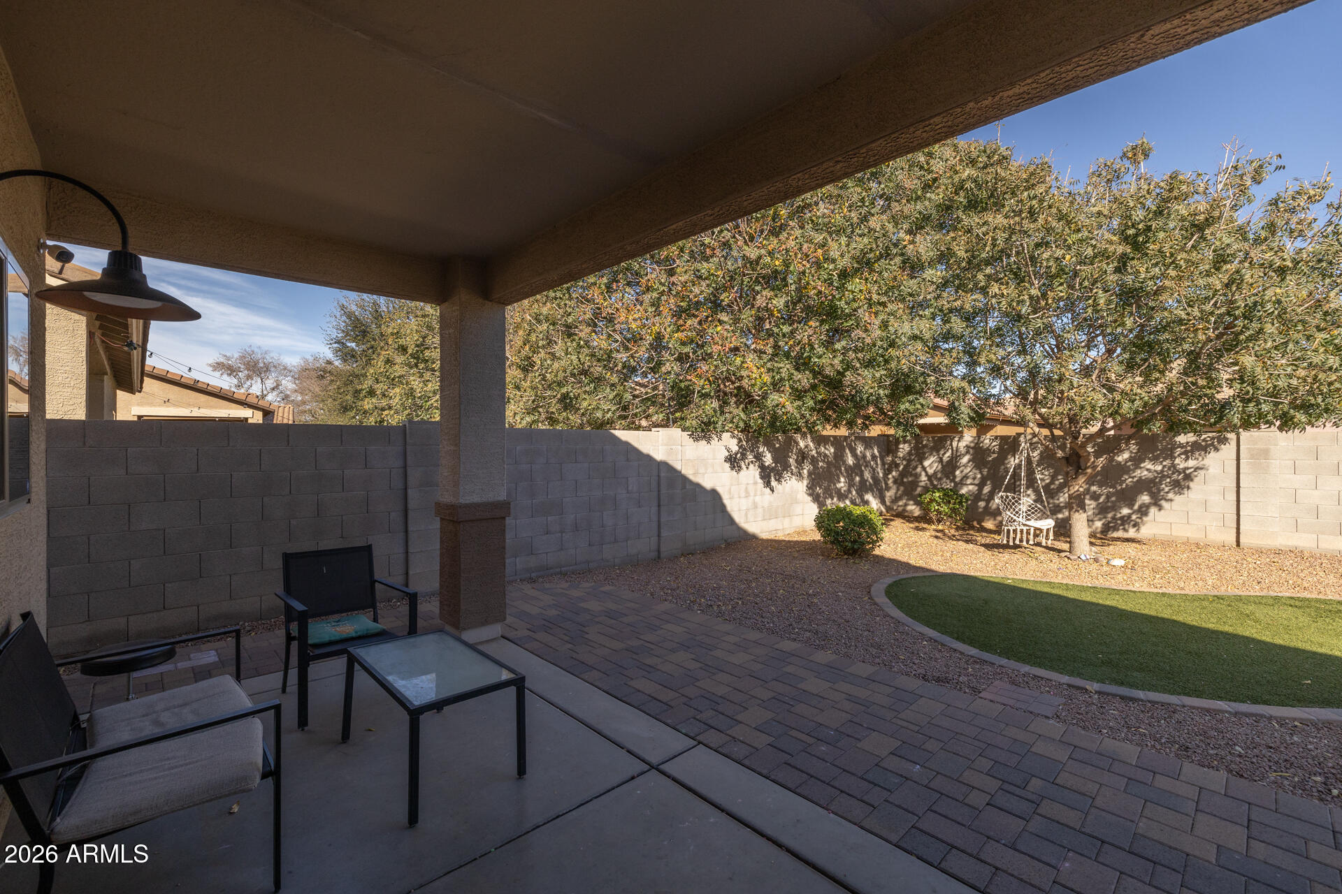 724 West Trellis Road Queen Creek, AZ 85140 - Photo 31 of 46 a view of a porch with furniture and a yard