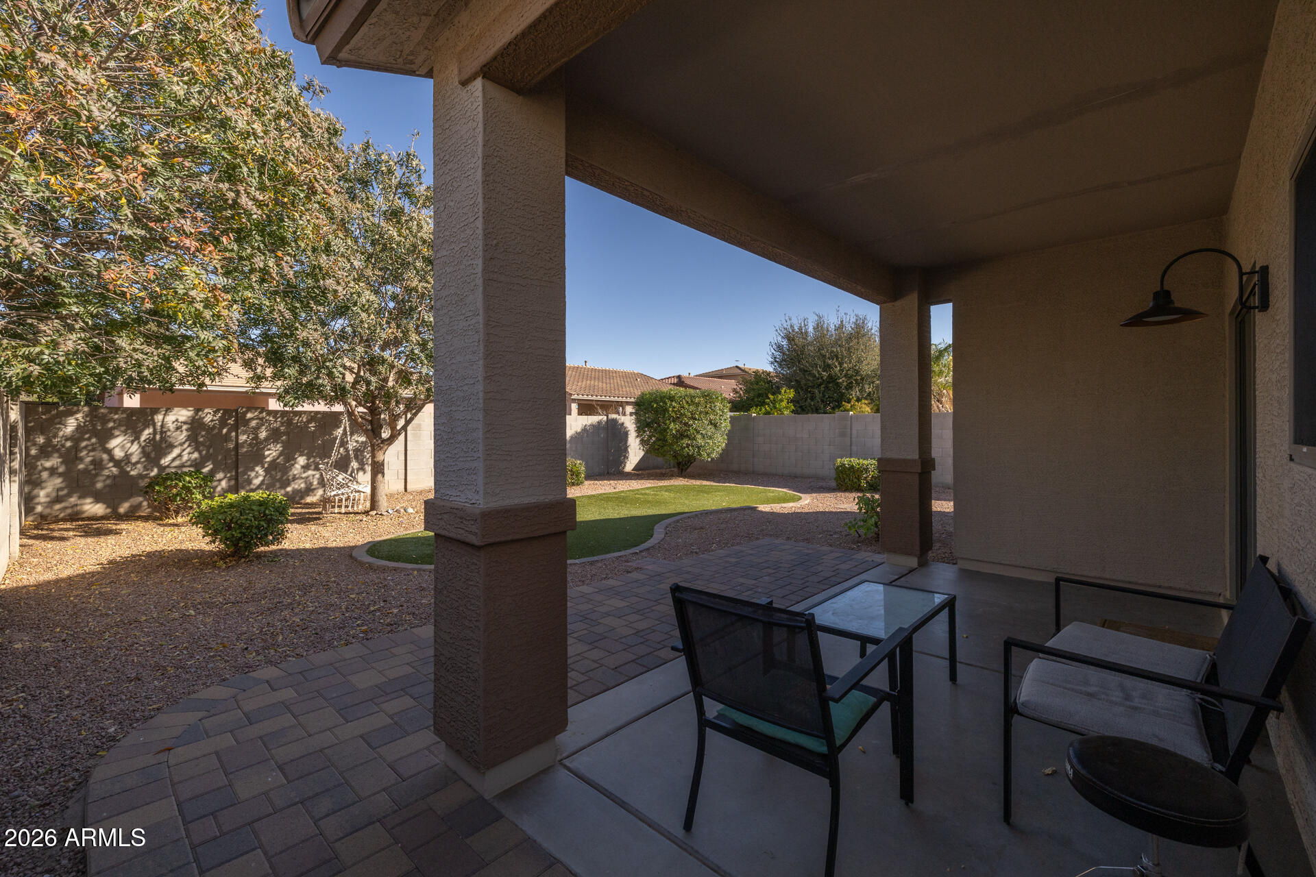 724 West Trellis Road Queen Creek, AZ 85140 - Photo 32 of 46 a view of a porch with furniture and a yard