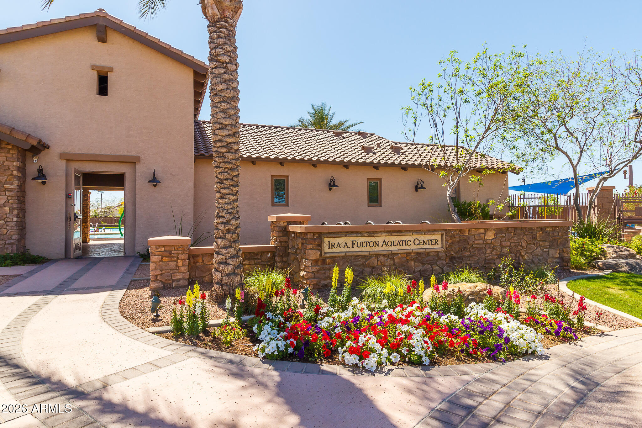 724 West Trellis Road Queen Creek, AZ 85140 - Photo 35 of 46 a front view of a house with a yard and fountain in middle