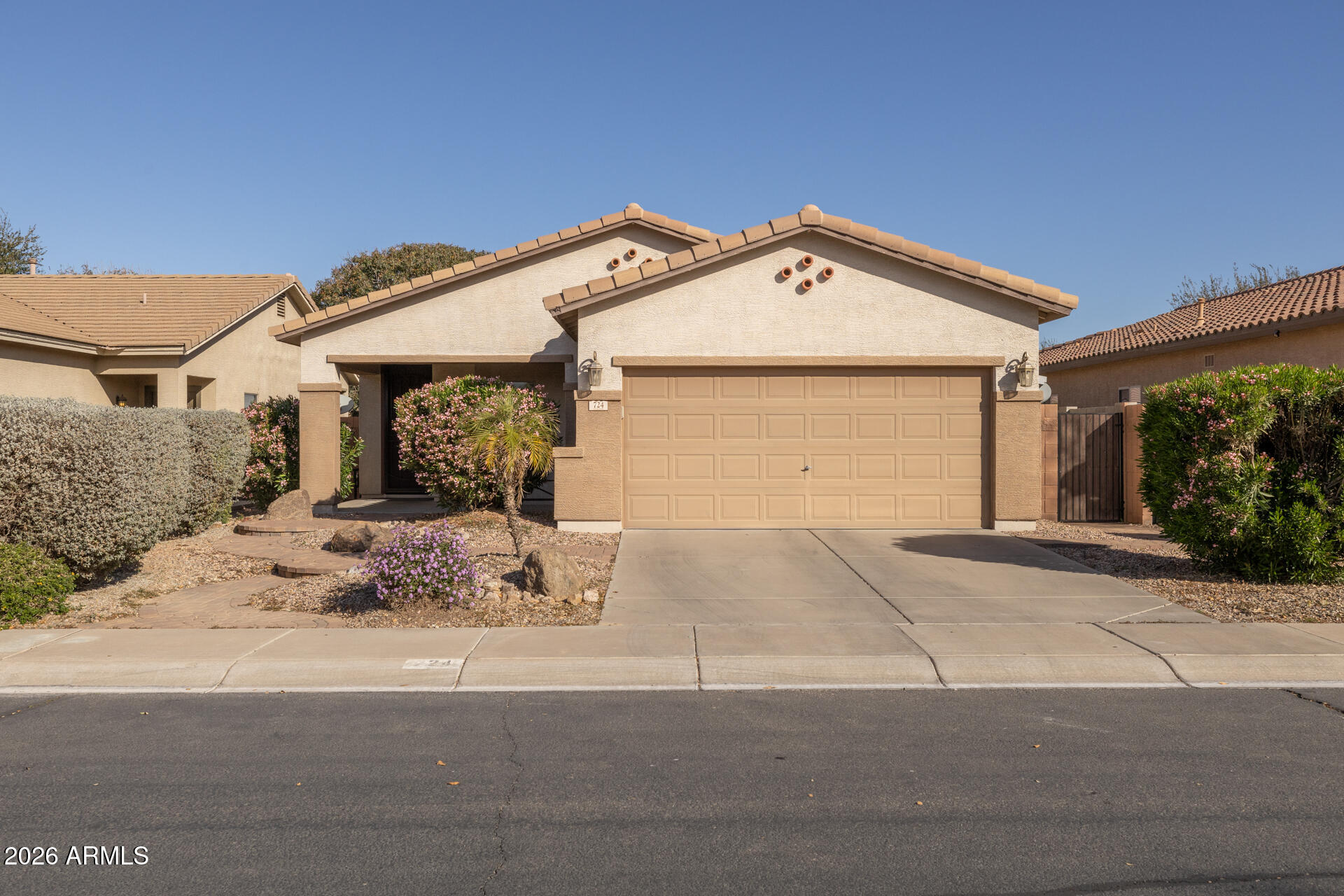 724 West Trellis Road Queen Creek, AZ 85140 - Photo 45 of 46 a front view of a house with a garage