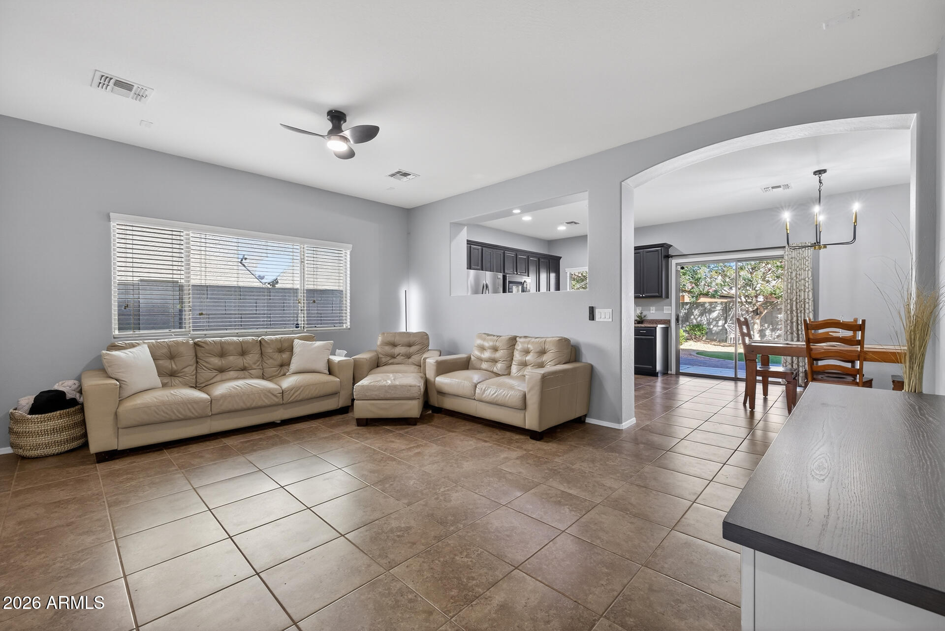 724 West Trellis Road Queen Creek, AZ 85140 - Photo 6 of 46 a living room with furniture and a large window