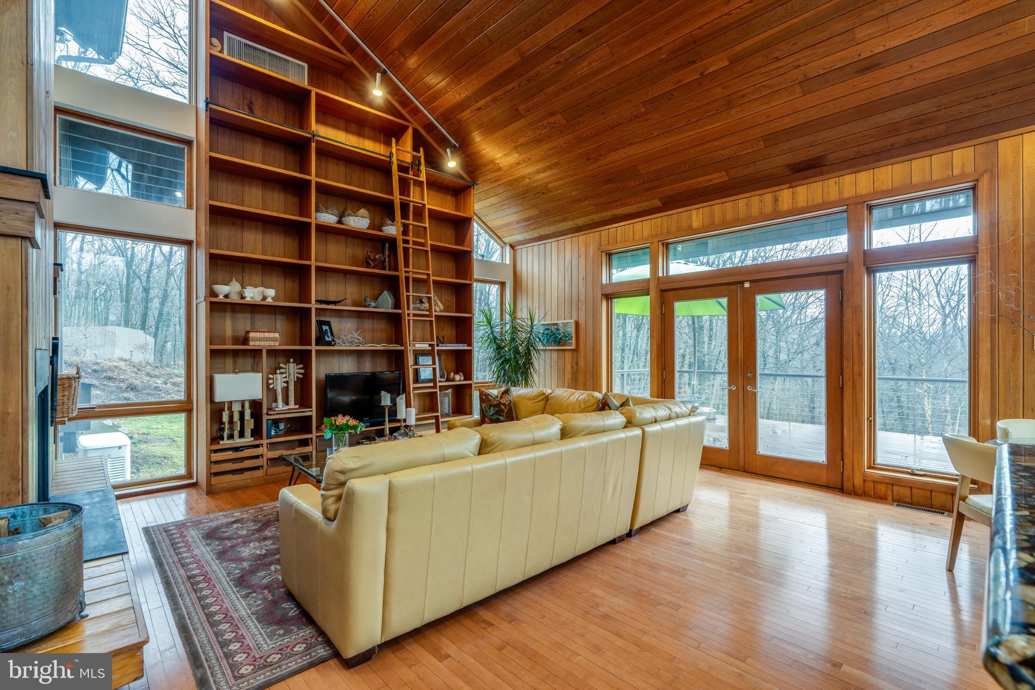 725 Laurel Ridge Road Reinholds, PA 17569 - Photo 43 of 101 a living room with furniture and a floor to ceiling window next to a large window