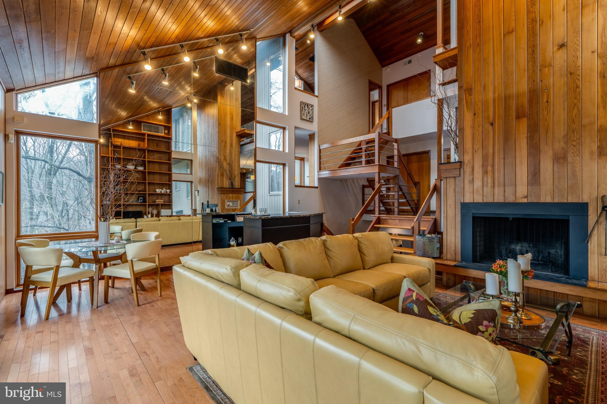 725 Laurel Ridge Road Reinholds, PA 17569 - Photo 46 of 101 a living room with furniture a fireplace and large windows