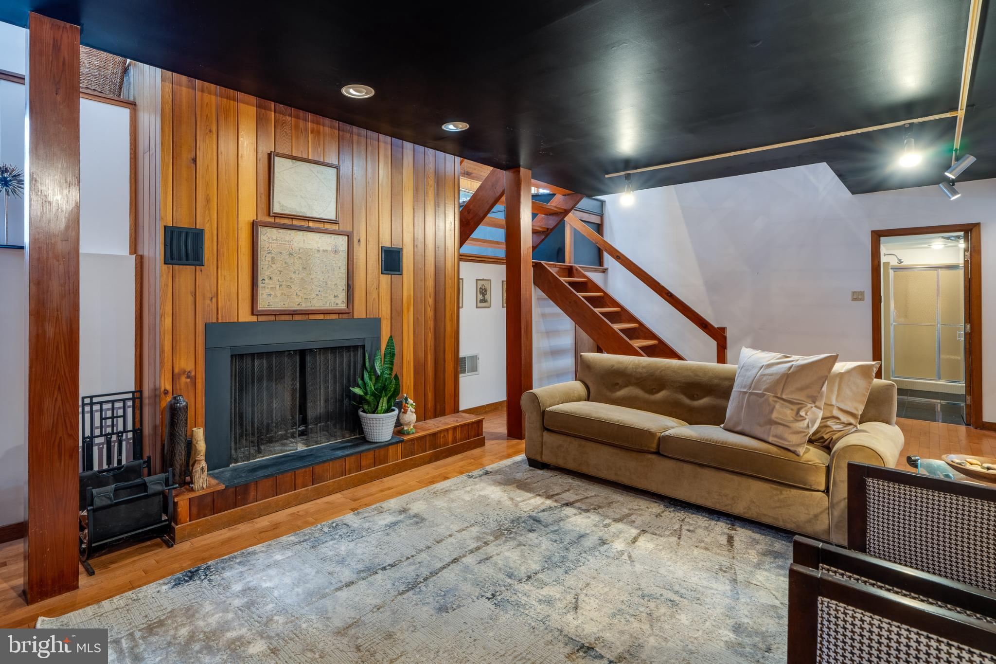 725 Laurel Ridge Road Reinholds, PA 17569 - Photo 64 of 101 a living room with furniture a fireplace and a floor to ceiling window