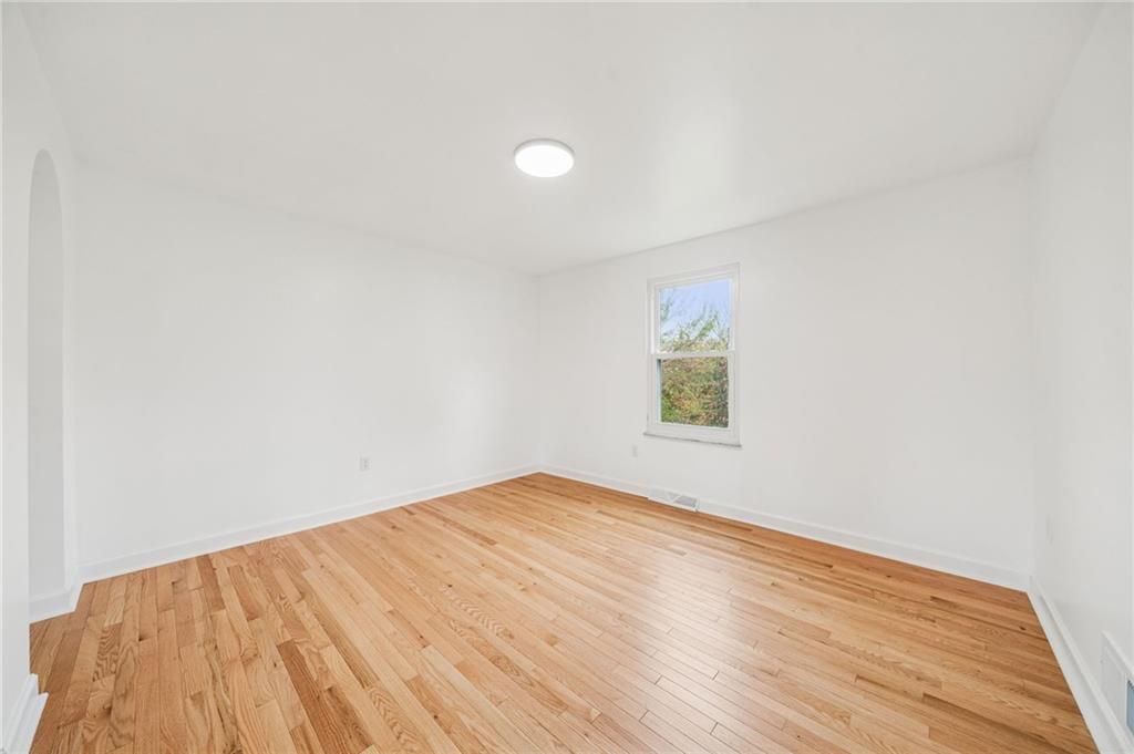 214 Ridgeview Drive Wexford, PA 15090 - Photo 12 of 43 an empty room with wooden floor and windows