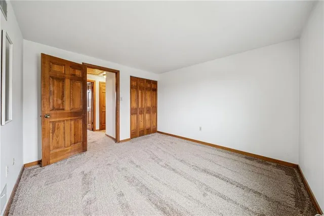 a view of an empty room and window