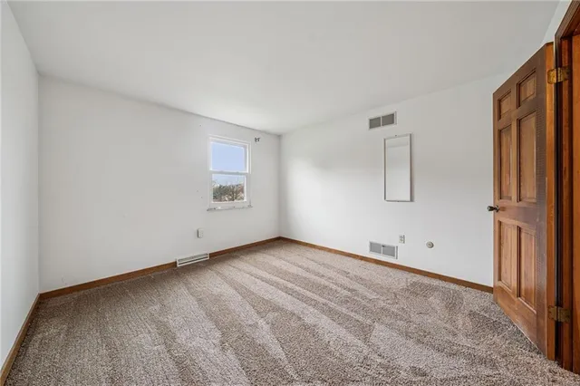 an empty room with a bench