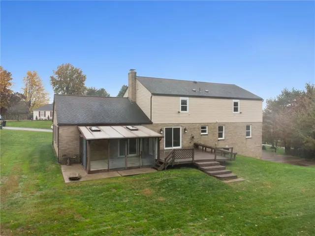 a view of outdoor space with deck and flat screen tv