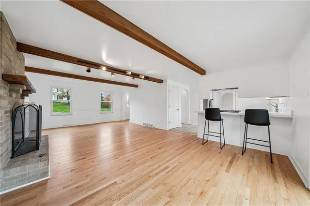 a view of kitchen with furniture and wooden floor