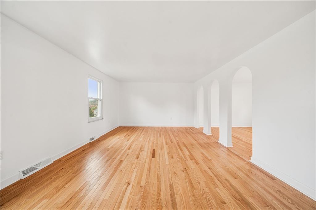 214 Ridgeview Drive Wexford, PA 15090 - Photo 6 of 43 an empty room with wooden floor and windows