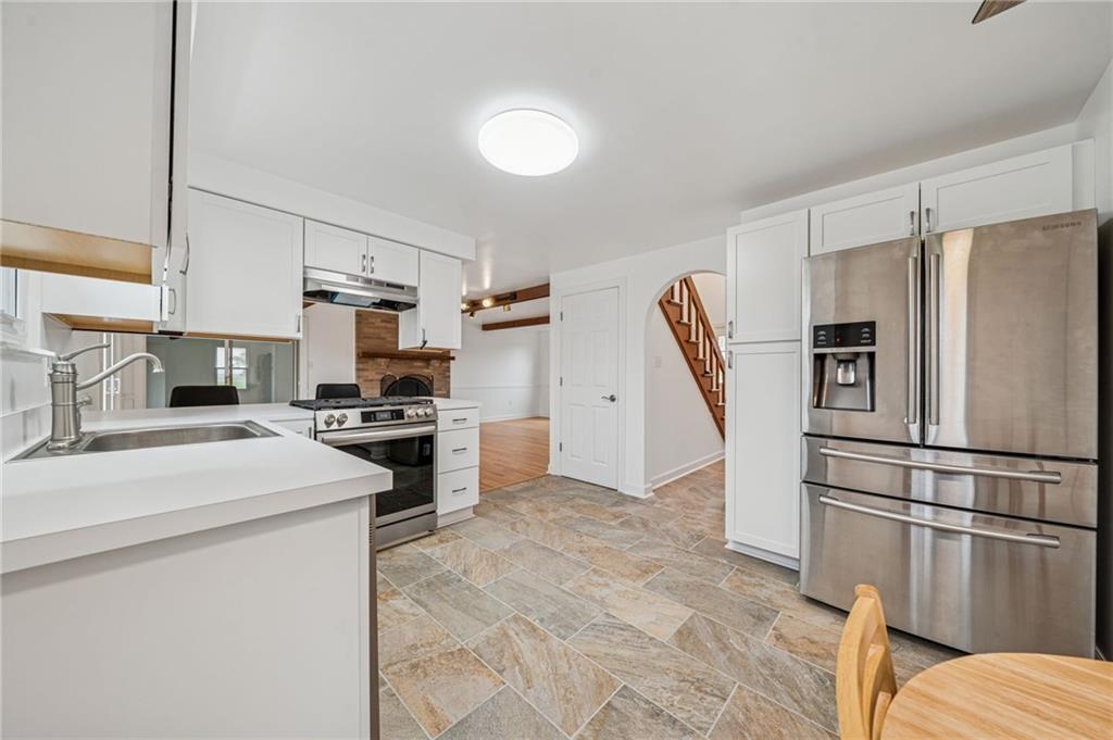 214 Ridgeview Drive Wexford, PA 15090 - Photo 8 of 43 a kitchen with stainless steel appliances a refrigerator stove microwave and sink