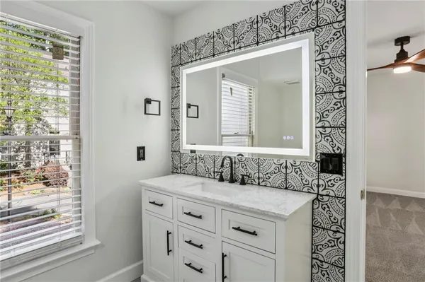 a bathroom with a sink and a mirror