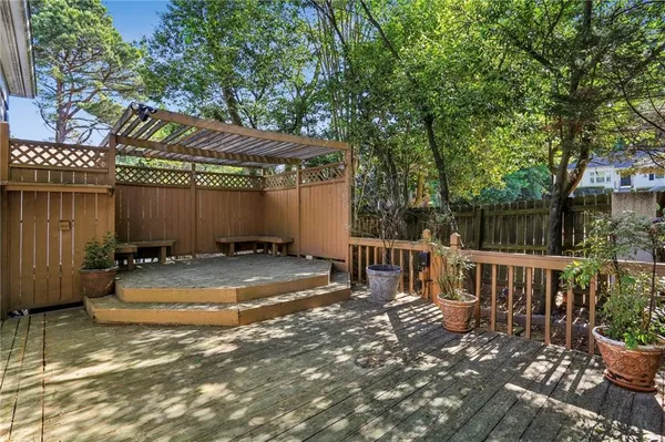 a view of a chair and table in the patio