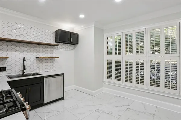 a kitchen with a sink and a refrigerator