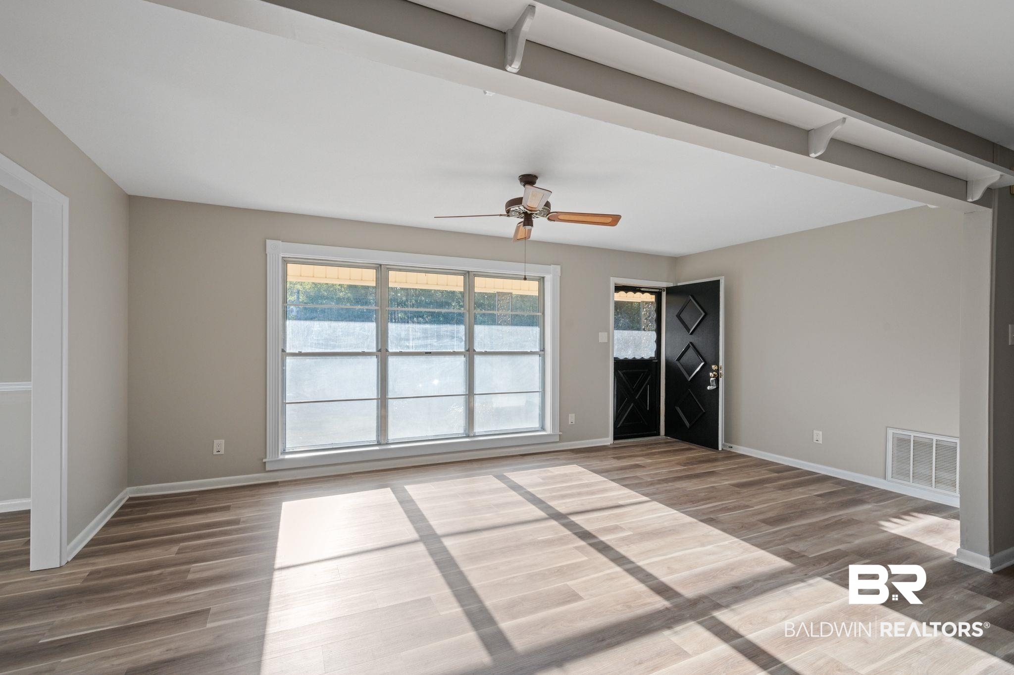 909 Caroline Avenue Daphne, AL 36526 - Photo 10 of 46 Spare room featuring ceiling fan and wood-type flooring
