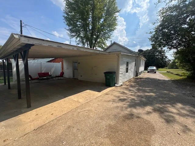 a backyard of a house with yard and garage