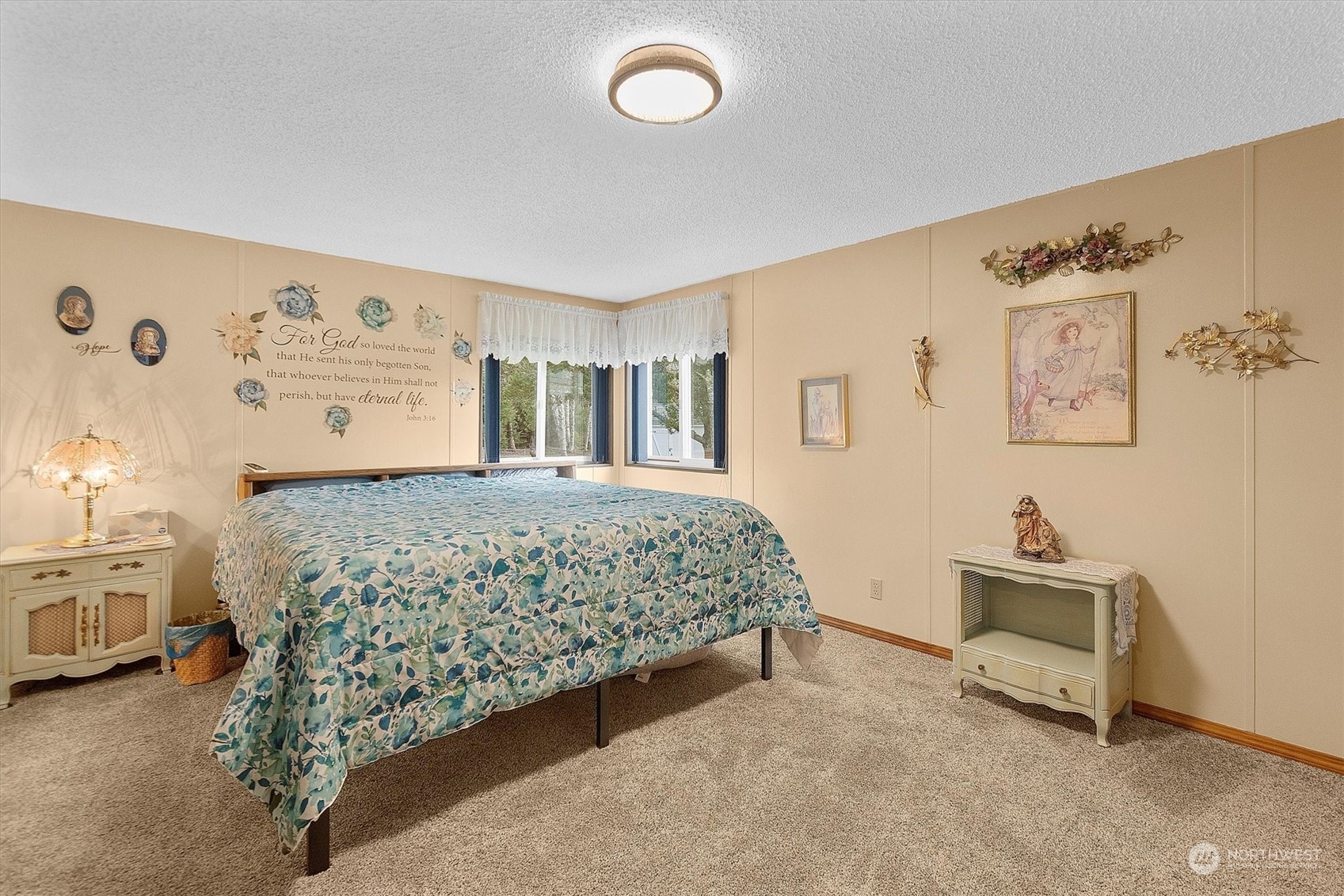 3901 67th Place Long Beach, WA 98631 - Photo 11 of 25 a bedroom with a bed and a lamp on the dresser