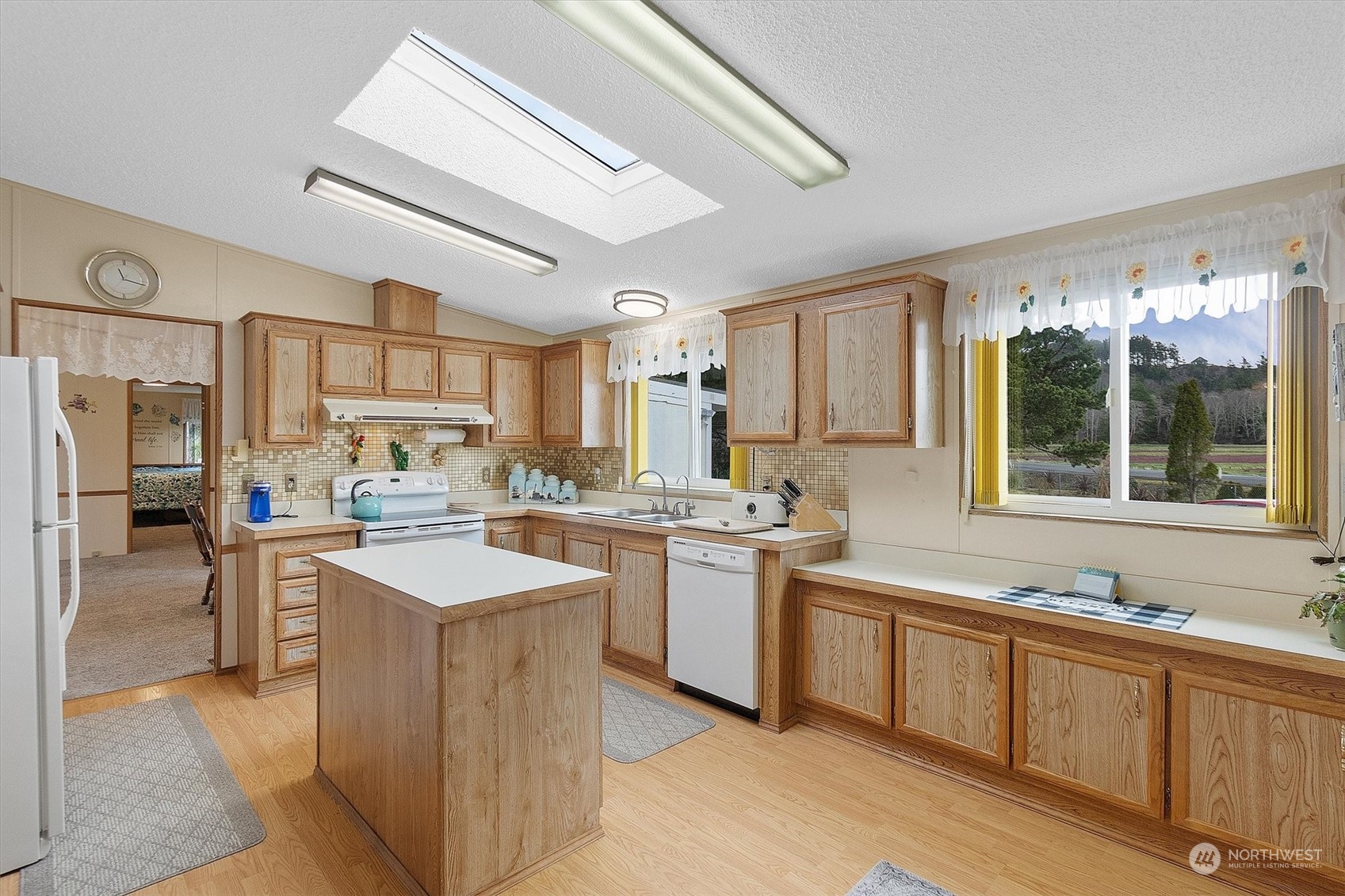 3901 67th Place Long Beach, WA 98631 - Photo 16 of 25 a kitchen with sink stove and refrigerator