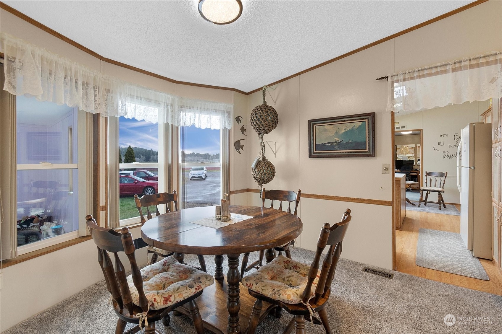 3901 67th Place Long Beach, WA 98631 - Photo 18 of 25 a view of a dining room with furniture and wooden floor