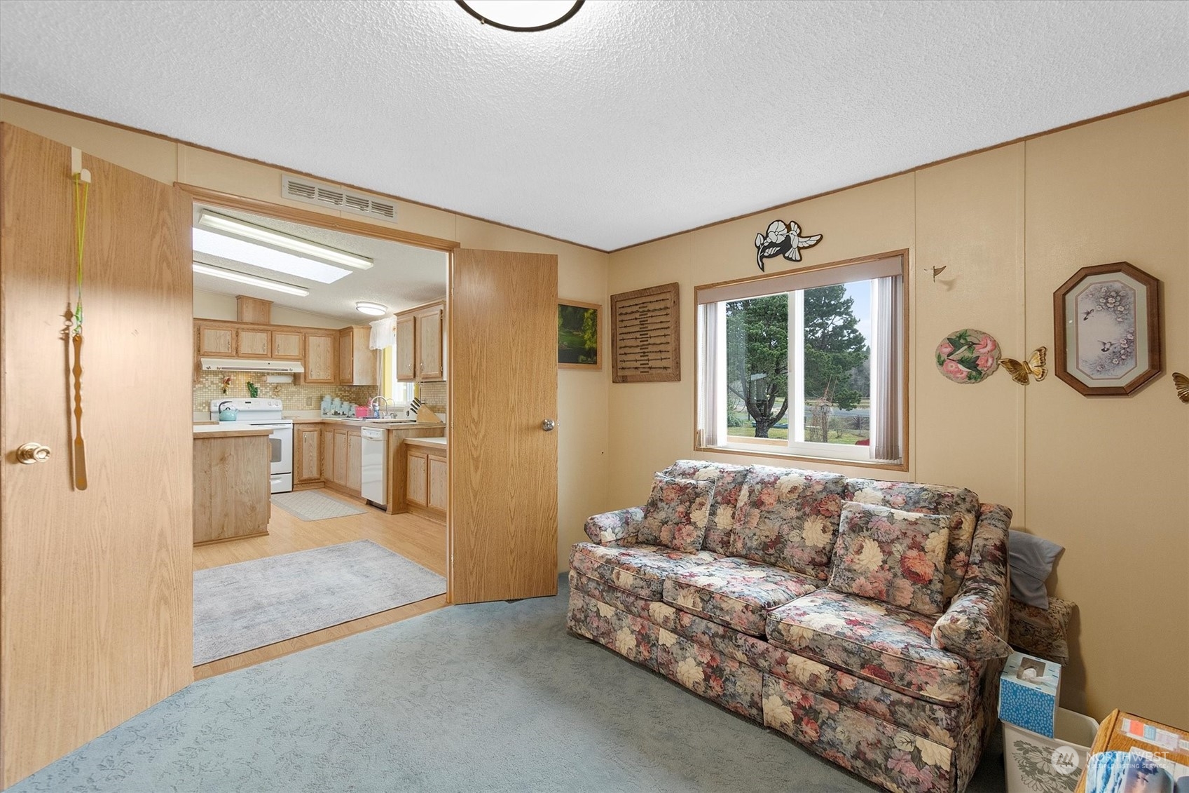 3901 67th Place Long Beach, WA 98631 - Photo 20 of 25 a living room with furniture and a large window