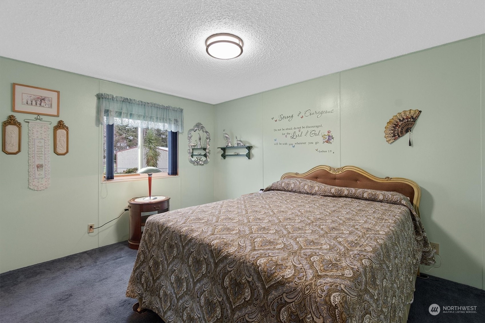 3901 67th Place Long Beach, WA 98631 - Photo 21 of 25 a bed sitting in a bedroom and a table