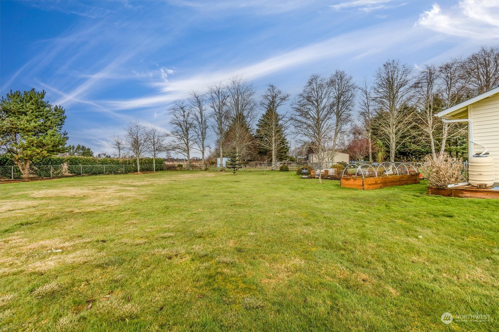 3901 67th Place Long Beach, WA 98631 - Photo 5 of 25 a view of a yard with a house in the background