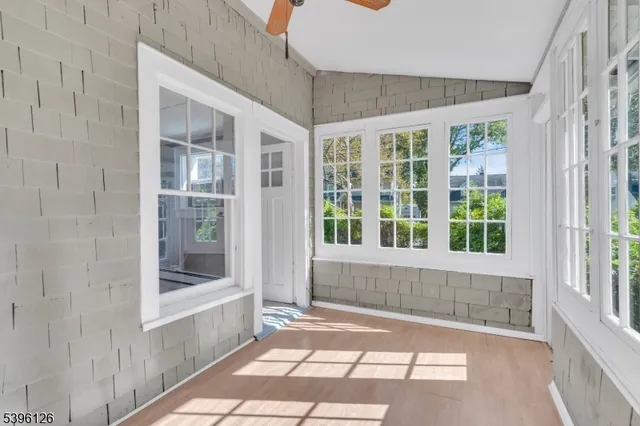 a view of a bathroom with a tub and windows