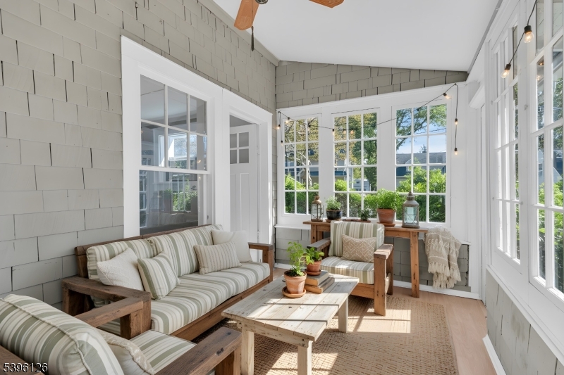 11 Maclennan Place, Unit A Fanwood, NJ 07023 - Photo 2 of 23 a living room with furniture and a large window