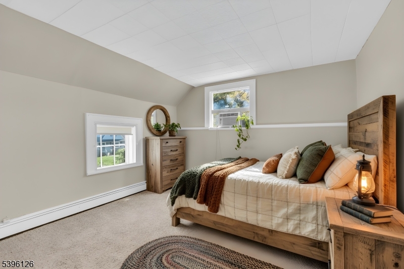 11 Maclennan Place, Unit A Fanwood, NJ 07023 - Photo 3 of 23 a bedroom with a bed and a window