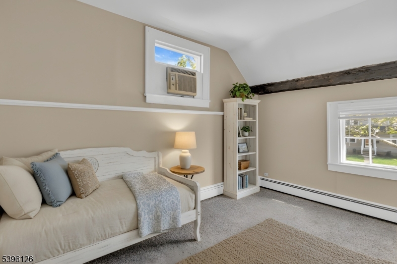 11 Maclennan Place, Unit A Fanwood, NJ 07023 - Photo 4 of 23 a bedroom with a bed and a window