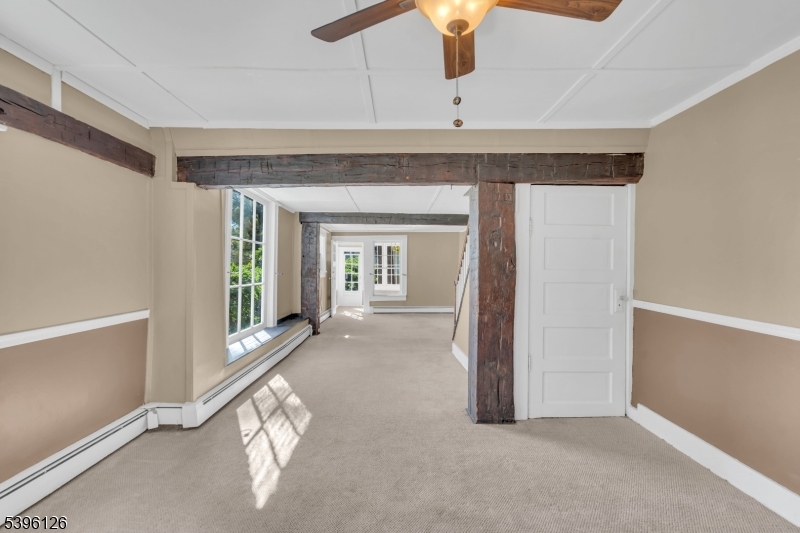 11 Maclennan Place, Unit A Fanwood, NJ 07023 - Photo 7 of 23 wooden floor in an empty room with a window