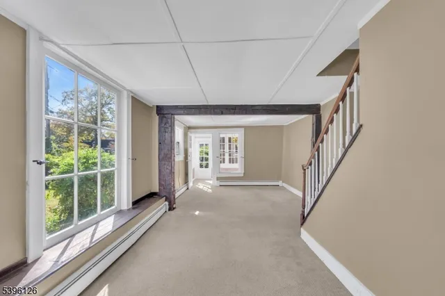 a view of hallway with windows