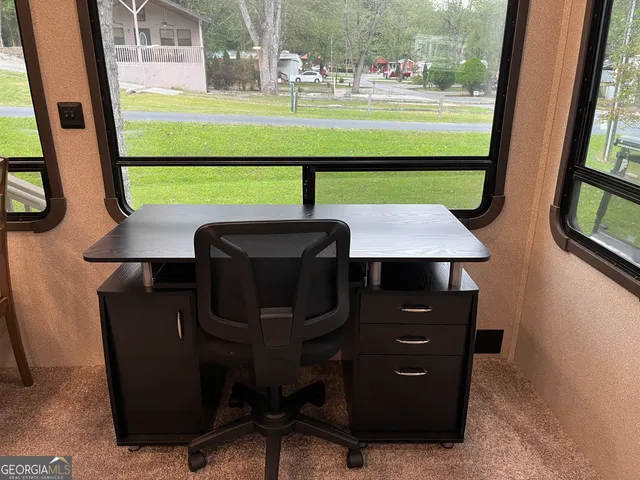 a room with lots of gym equipment and window