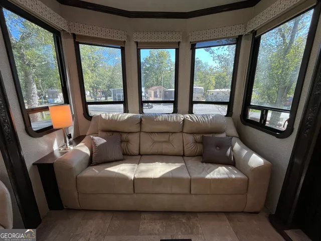a view of a bathroom with a sink and wooden floor