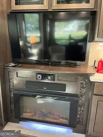 a bathroom with a toilet and a mirror