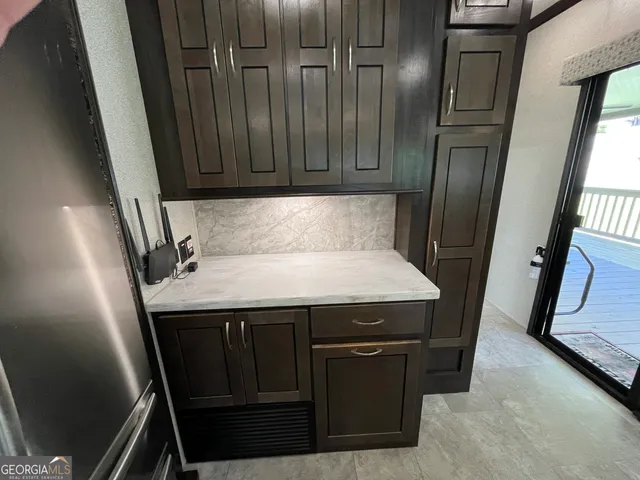 a view of a chair and table in the garden