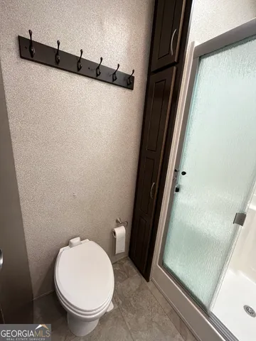 a view of a house with backyard and a slide