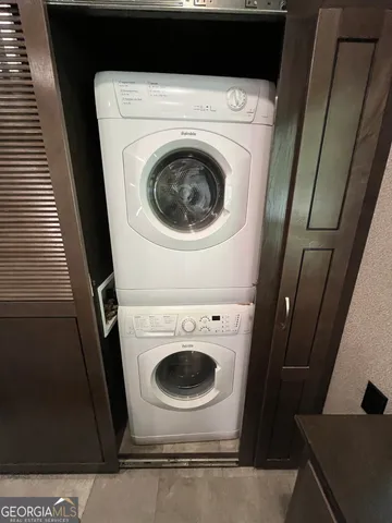 a view of a chair and tables in the garden