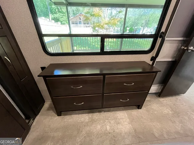 a view of swimming pool with sitting area and furniture