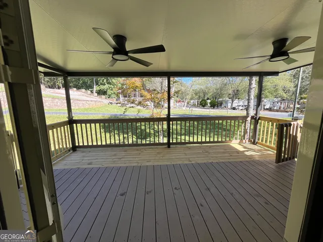 a view of a patio with a table and chairs