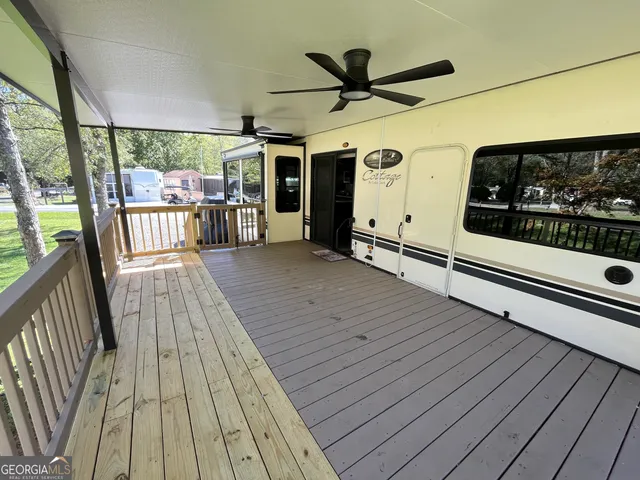 a view of a patio with a table and chairs