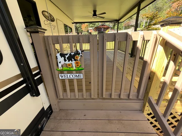 a view of a porch with wooden floor