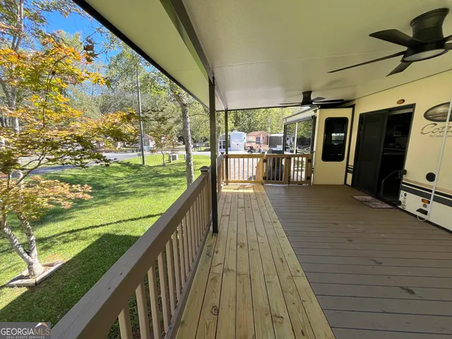 a living room with lots of furniture and a window